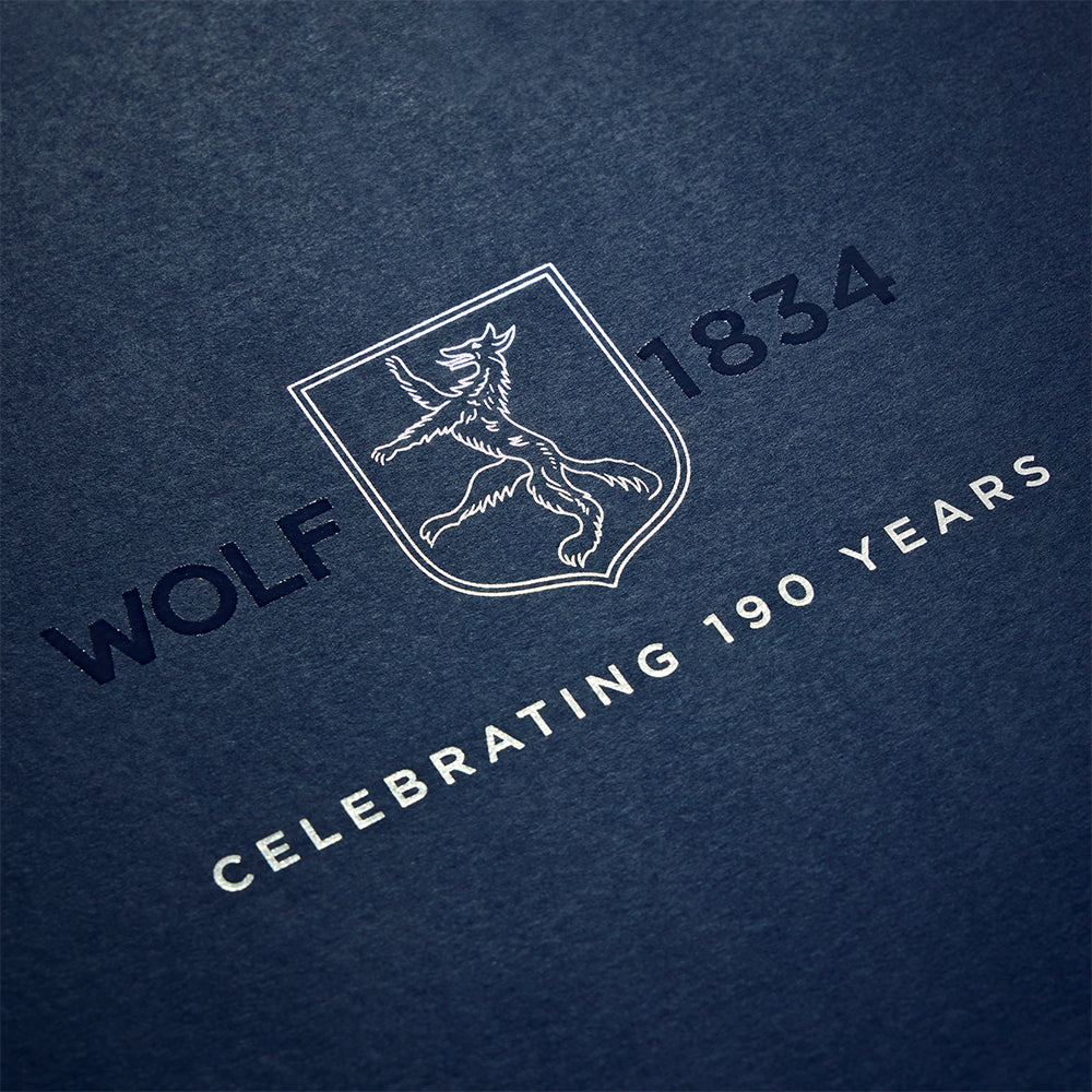 Wolf crest logo on a blue background featuring 1834 and Celebrating 190 Years inscription.
