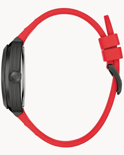 Bulova Maquina 98A341 automatic men's watch with black skeleton dial, black case and red rubber strap — angled view