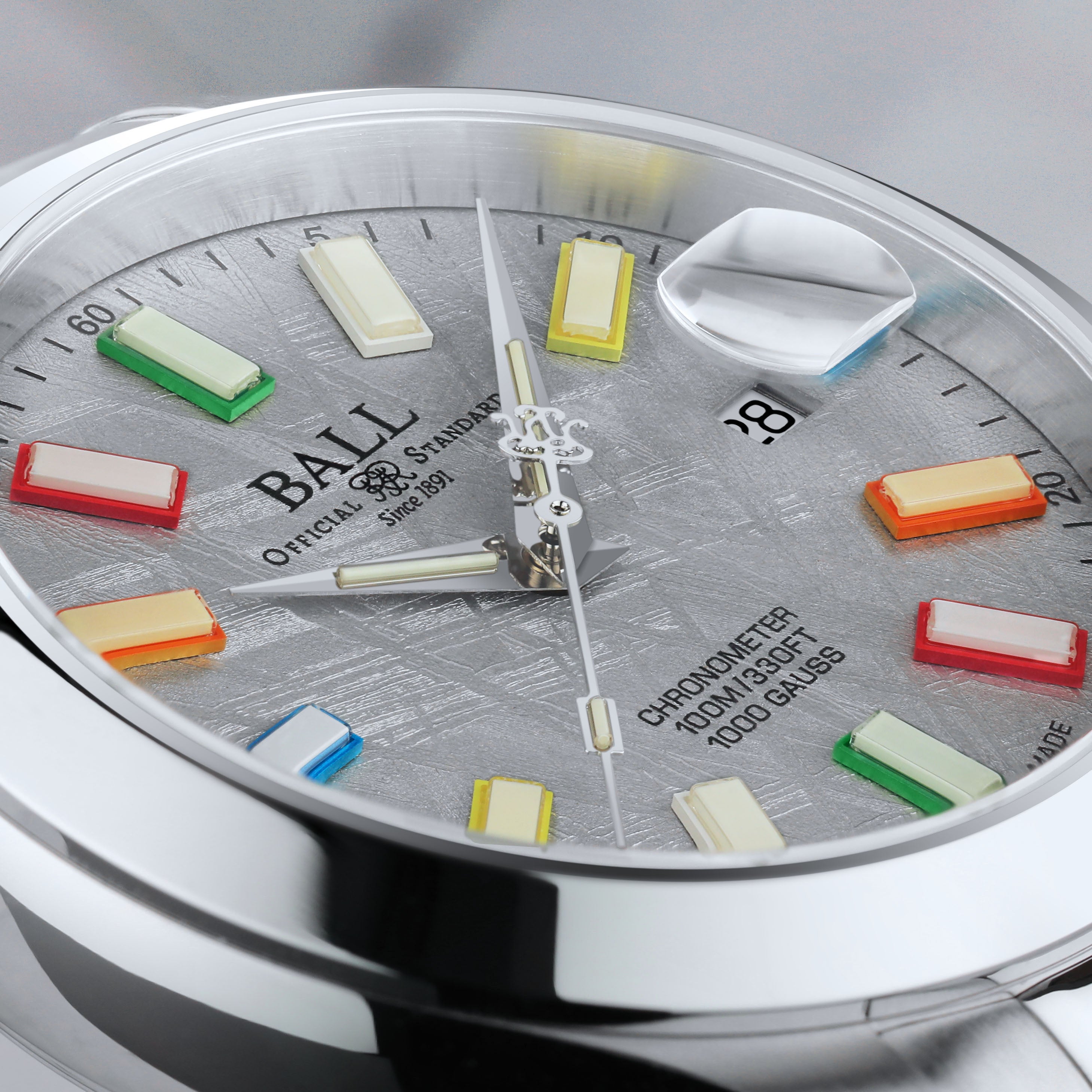 Detailed view of Ball Engineer III Marvelight Chronometer Meteorite watch dial with colorful luminous markers and meteorite texture.