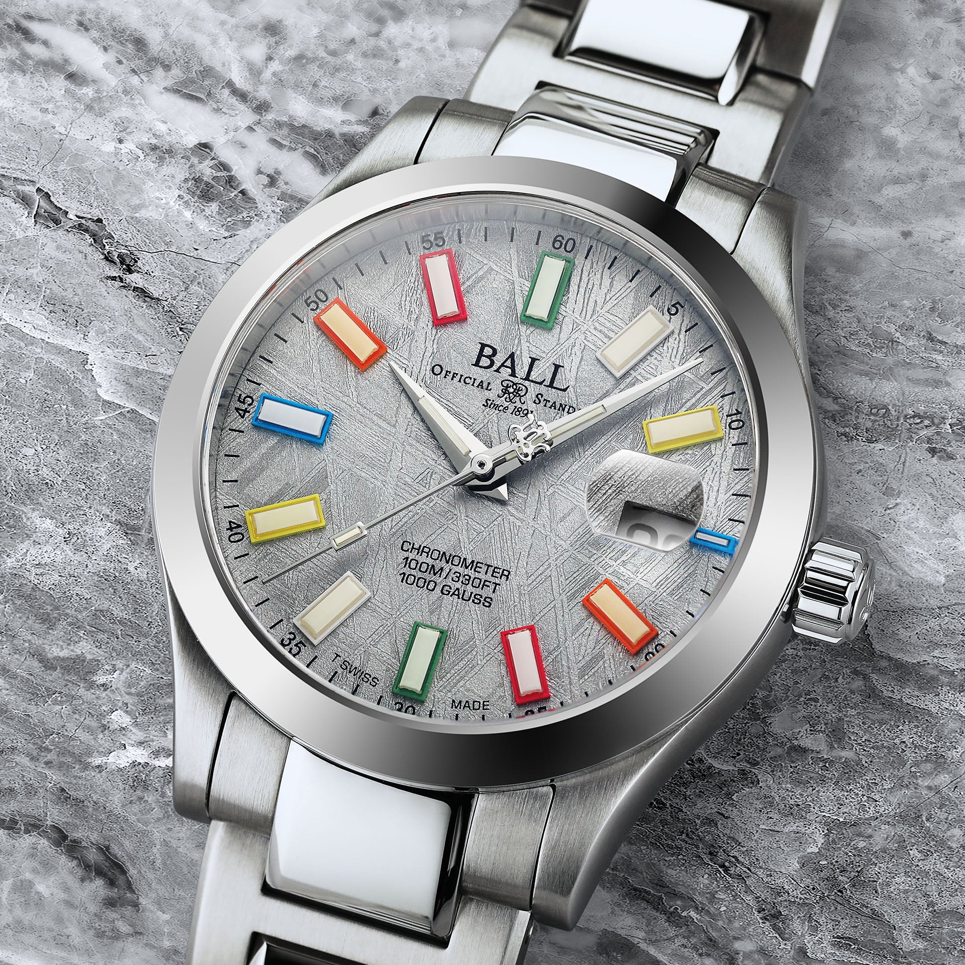 Close-up of Ball Engineer III Marvelight Chronometer Meteorite watch showcasing its silver meteorite dial and colorful luminous markers.