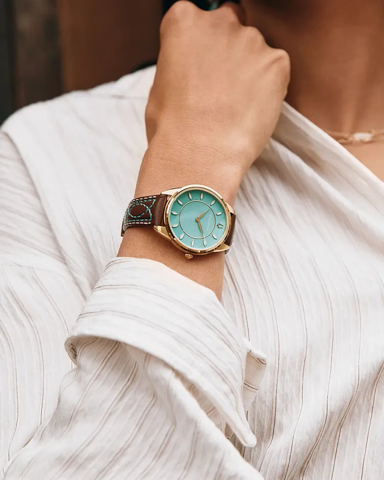 Bulova Sutton 97L203 women's watch with turquoise mother-of-pearl dial and tobacco brown leather strap — caseback view