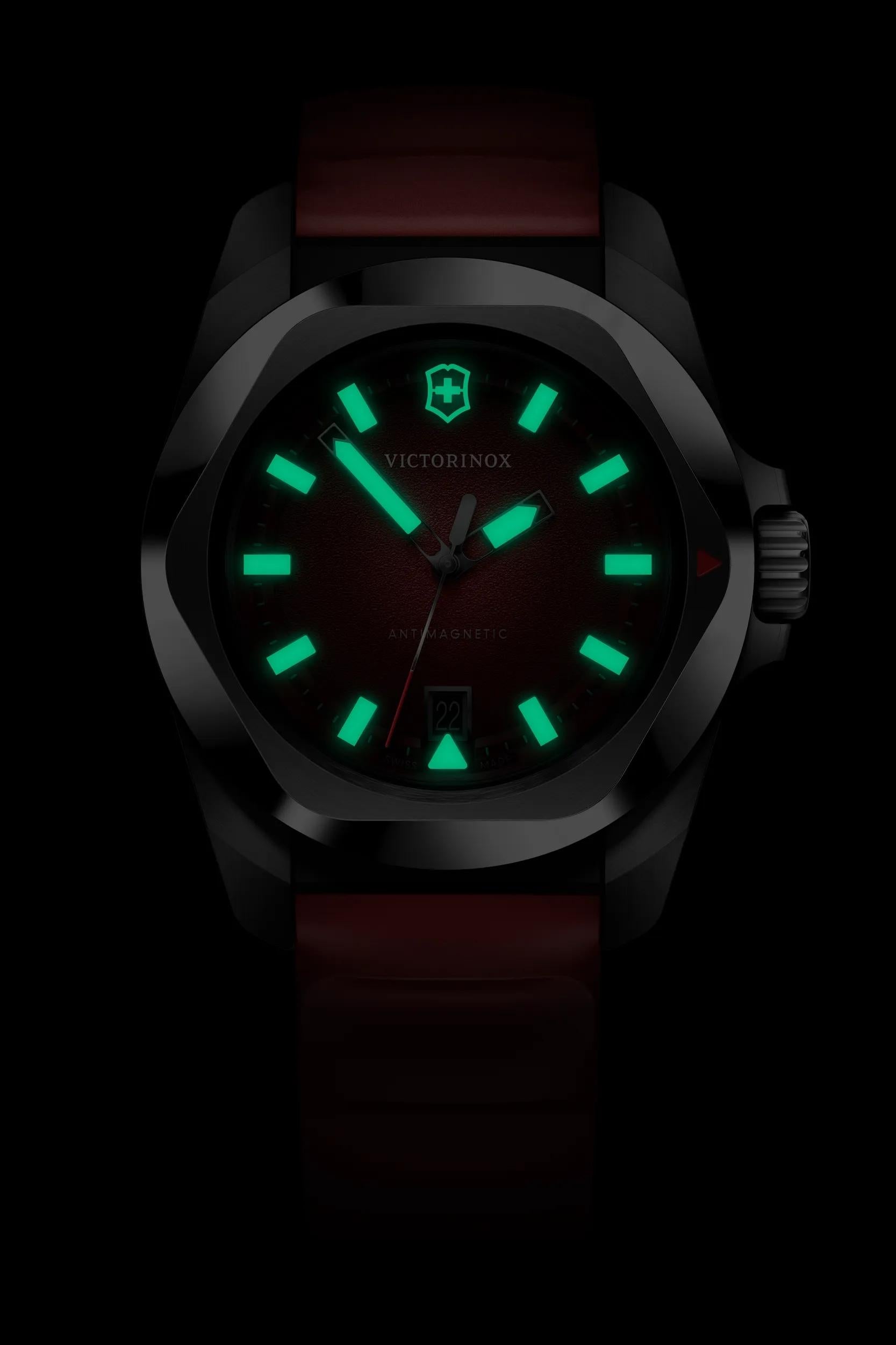 Victorinox Antimagnetic I.N.O.X. Quartz 242029 with a red grainy dial, luminous markers, stainless steel case.