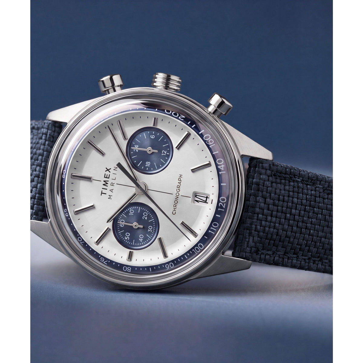 Timex Marlin Jet Chronograph TW2Y89900 silver sunray dial on a navy woven strap, styled detail