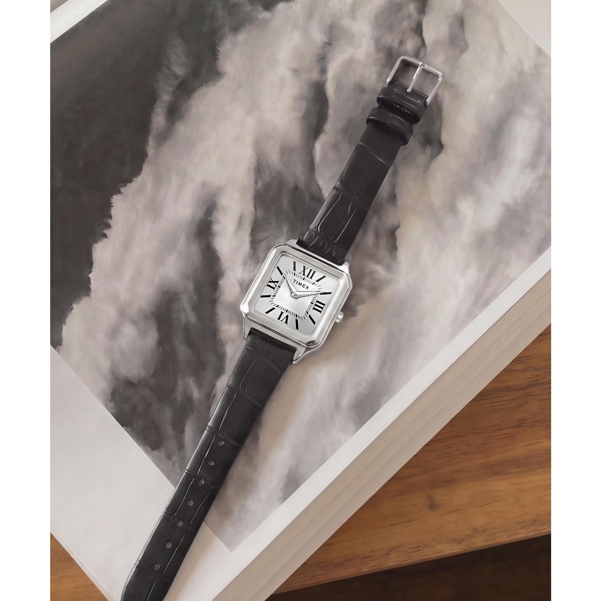 Timex Addison TW2Y90600 silver dial with Roman numerals on a black leather strap, styled detail