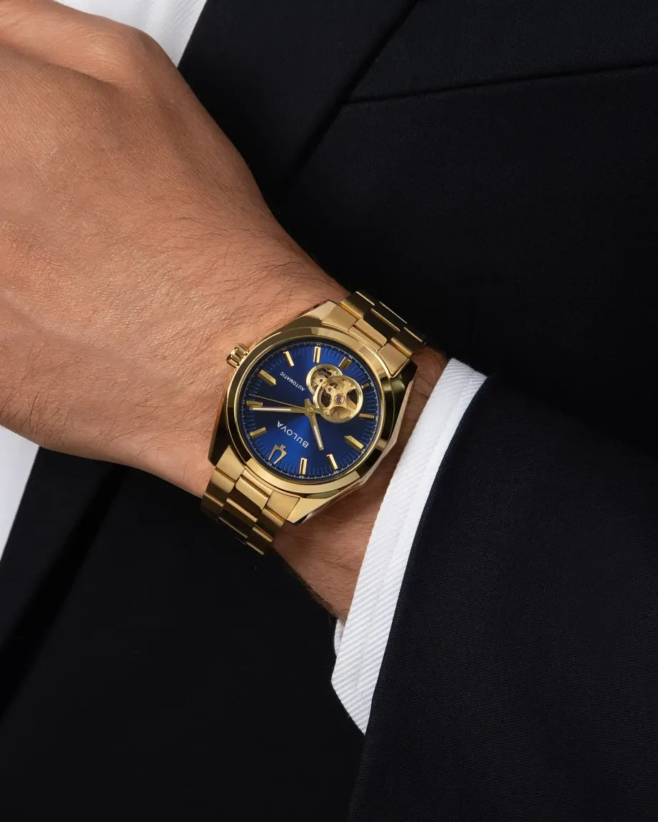 Bulova Surveyor 97A203 automatic men's watch with blue dial and gold-tone stainless steel bracelet — caseback view