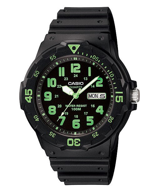 Black Casio wristwatch with green numerals and markings on the dial.