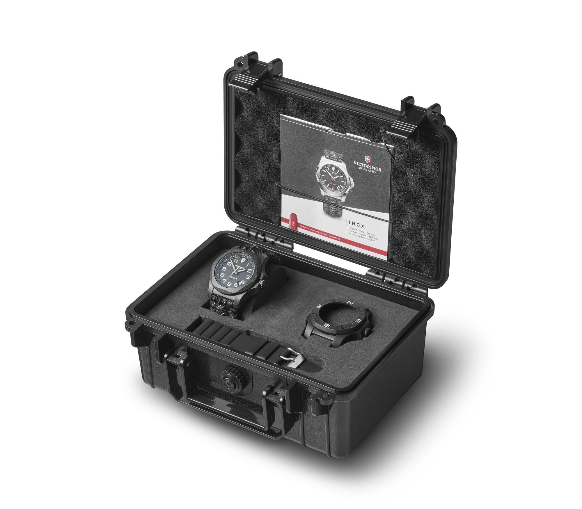 Protective hard case containing a wristwatch and accessories.
