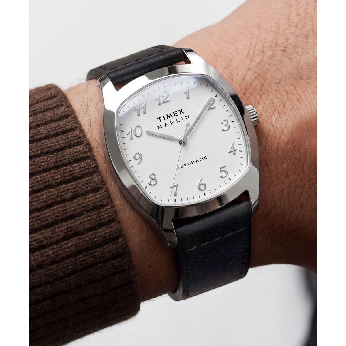 Timex Marlin Tonneau TW2Y84300 black leather strap shown flat beside the white dial