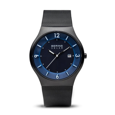 Sleek black wristwatch with a dark blue dial and mesh metal band.