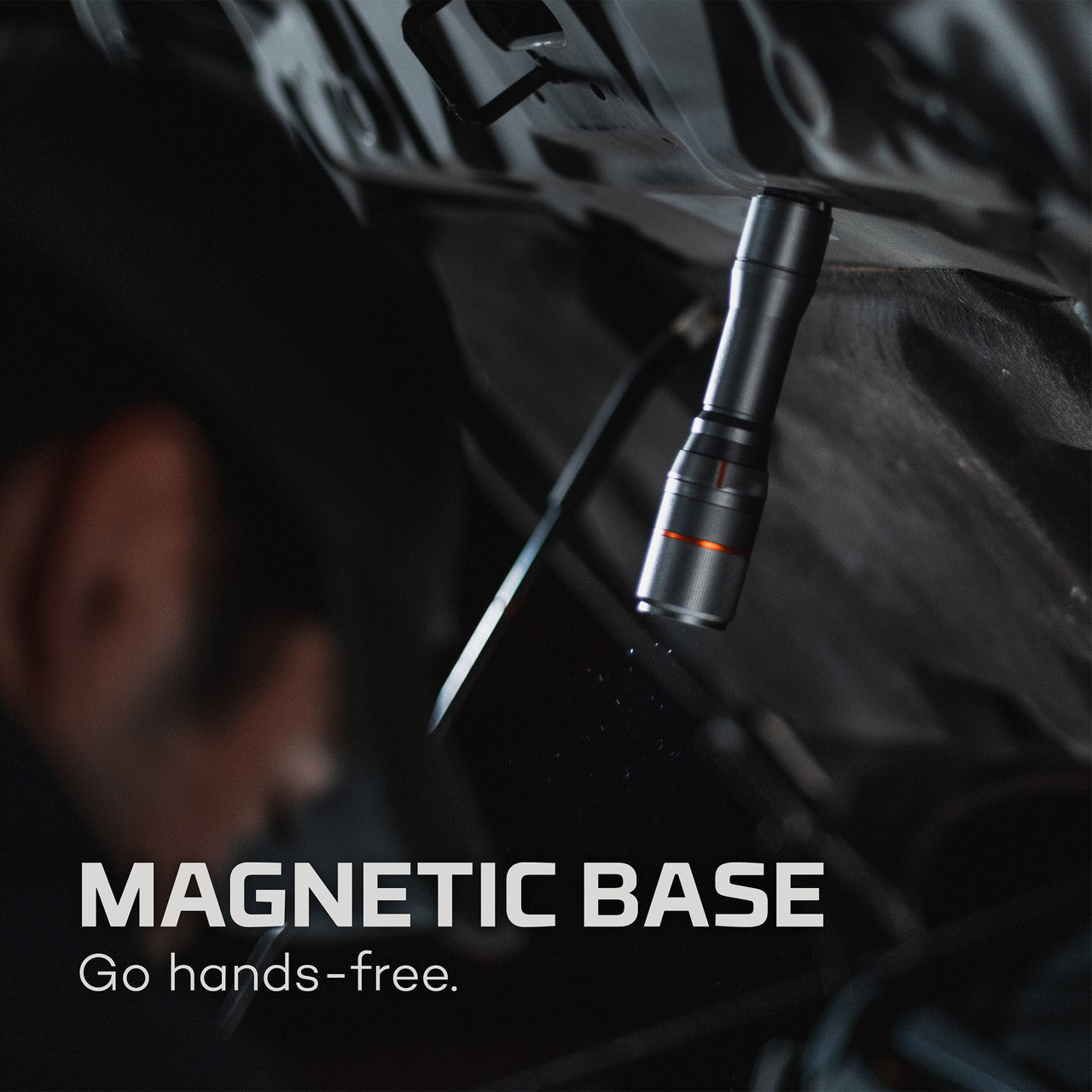 Cylindrical metal flashlight with a magnetic base.