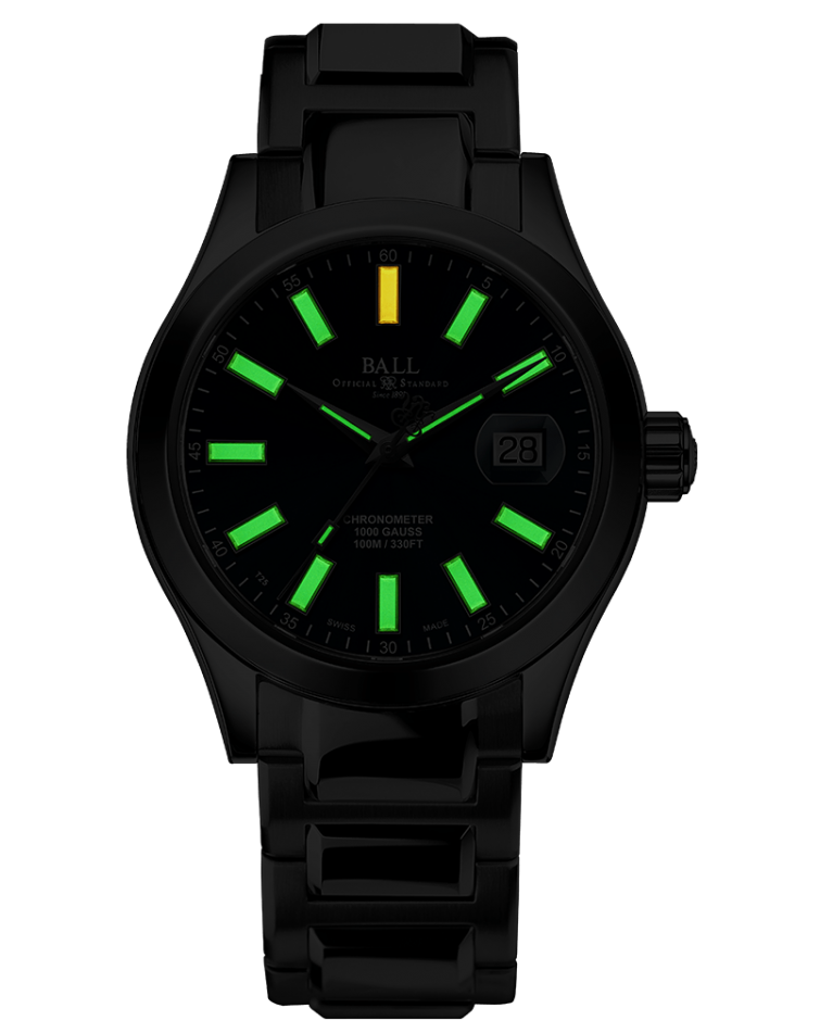 Black wristwatch with luminous green and yellow hour markers on its face.