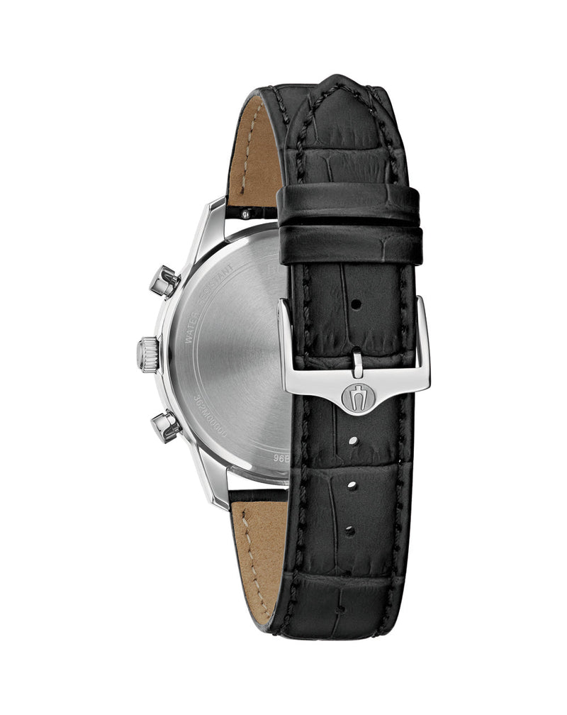 Wristwatch with a silver case and black leather strap.