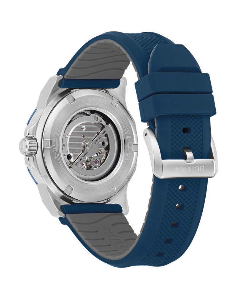 Wristwatch with a silver case and blue rubber strap.