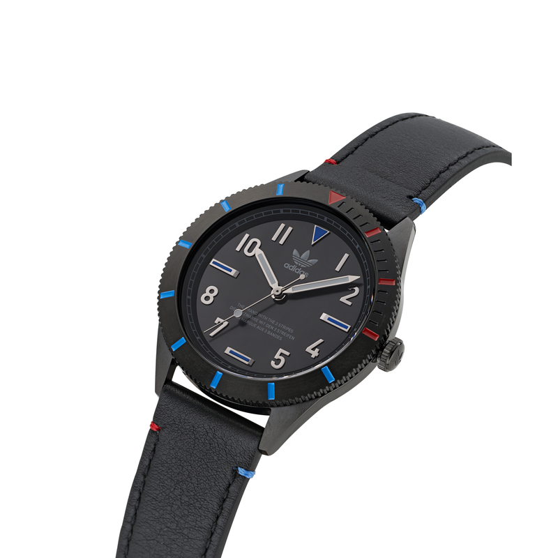 Black wristwatch with a round face and colorful accents on the bezel.