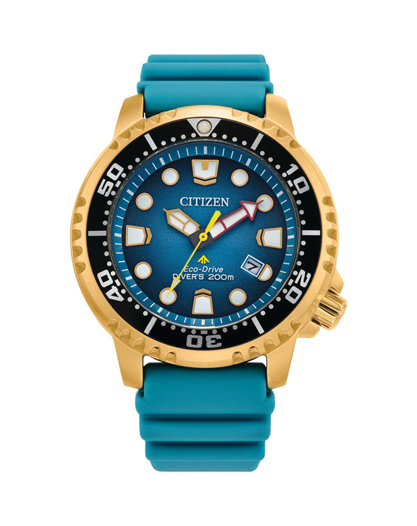 Gold and teal Citizen dive watch with a blue dial and rubber strap.