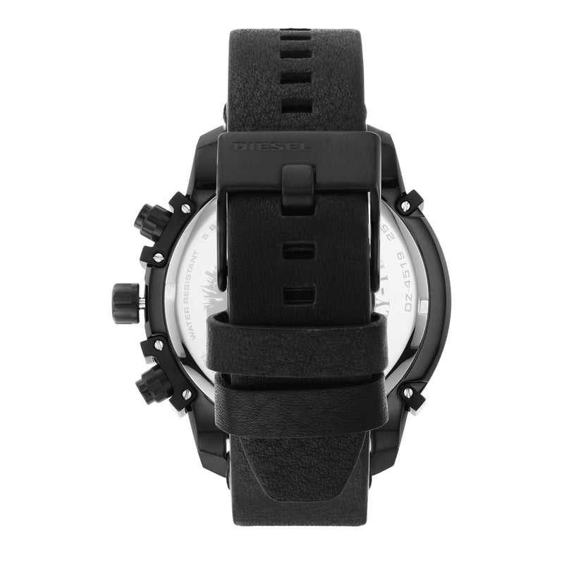 Black wristwatch with a rubber strap viewed from the back.