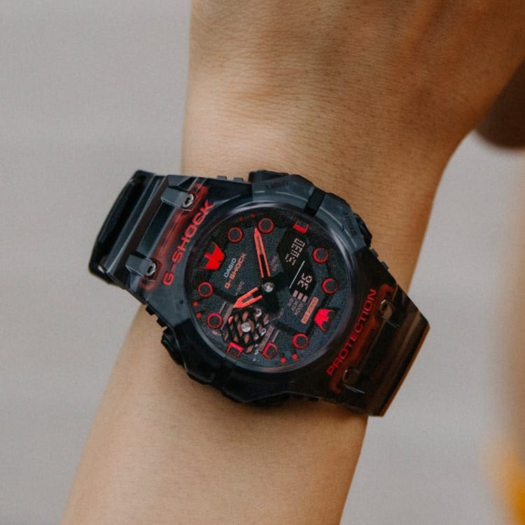 Black and red digital wristwatch with a rugged, sporty design.