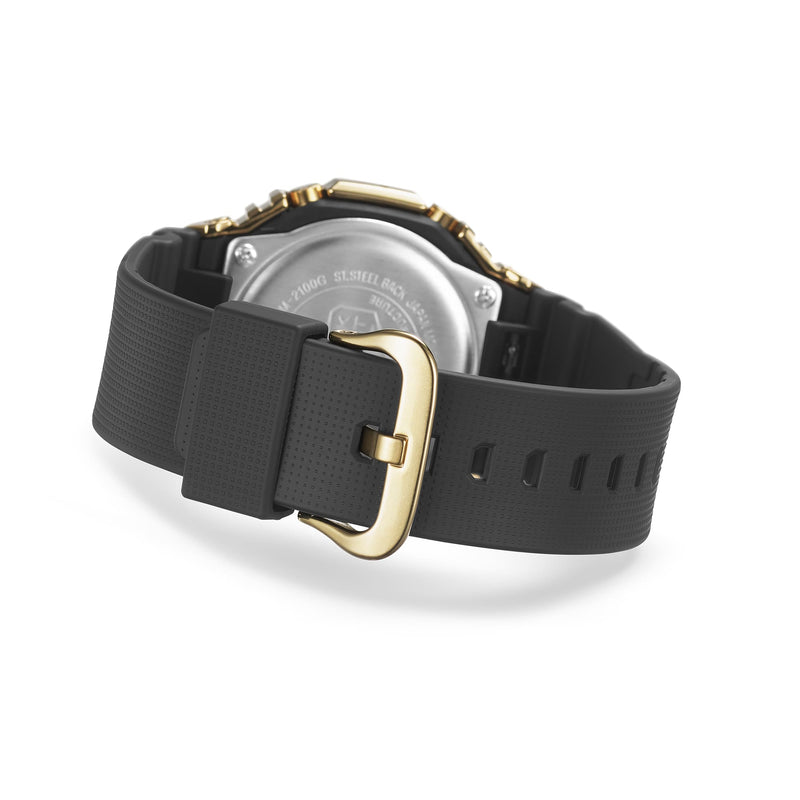 Black wristwatch with a gold-tone buckle and accents on a rubber strap.