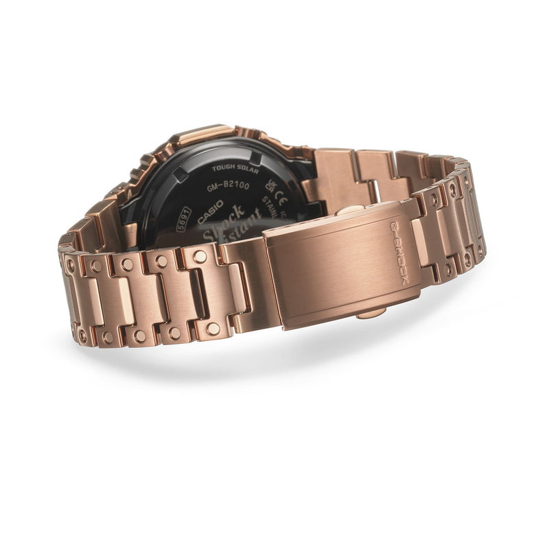 Rose gold metal watch band with a visible portion of the watch face.