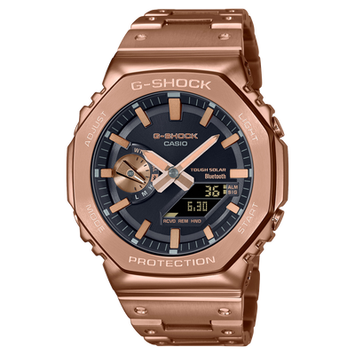 Rose gold G-Shock watch with a black dial and digital-analog display.