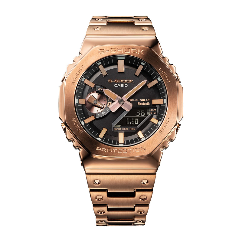 Rose gold G-Shock wristwatch with a black dial and metal bracelet.