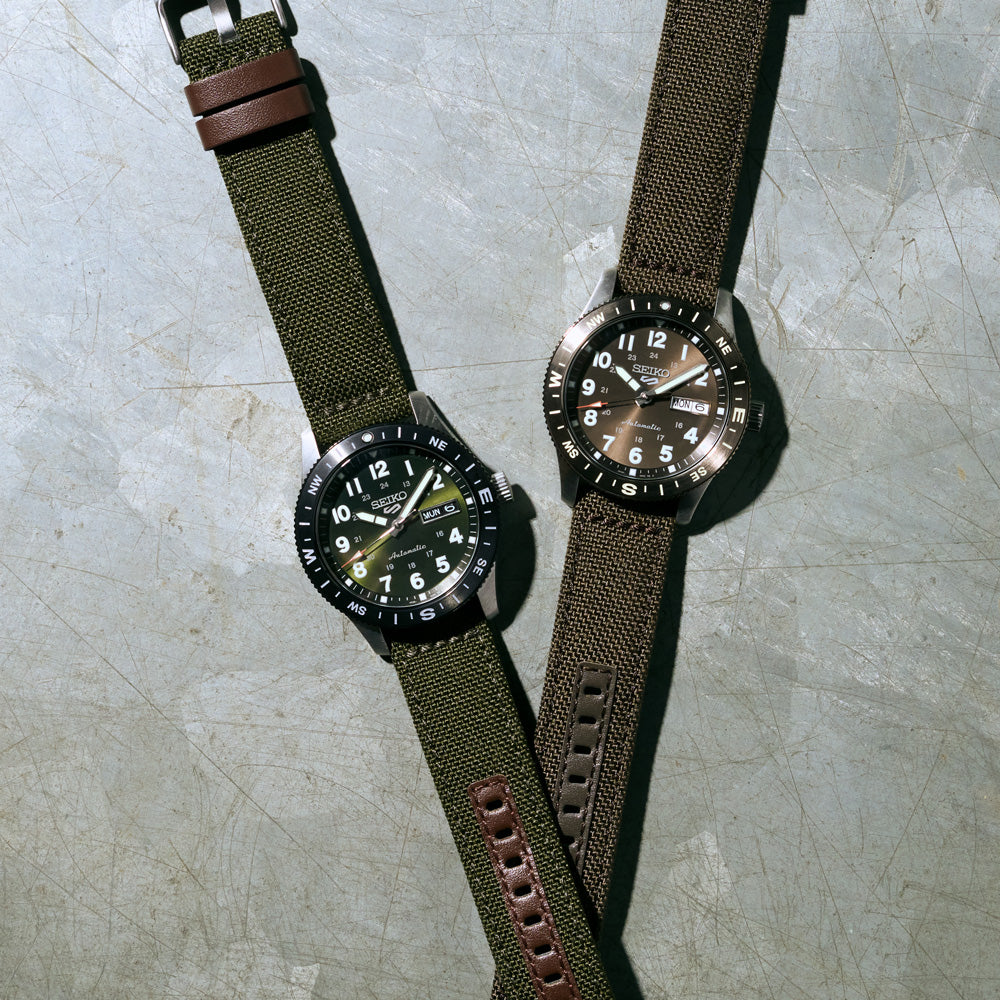 Profile view of the Seiko HDB009K case on its brown nylon and leather strap.
