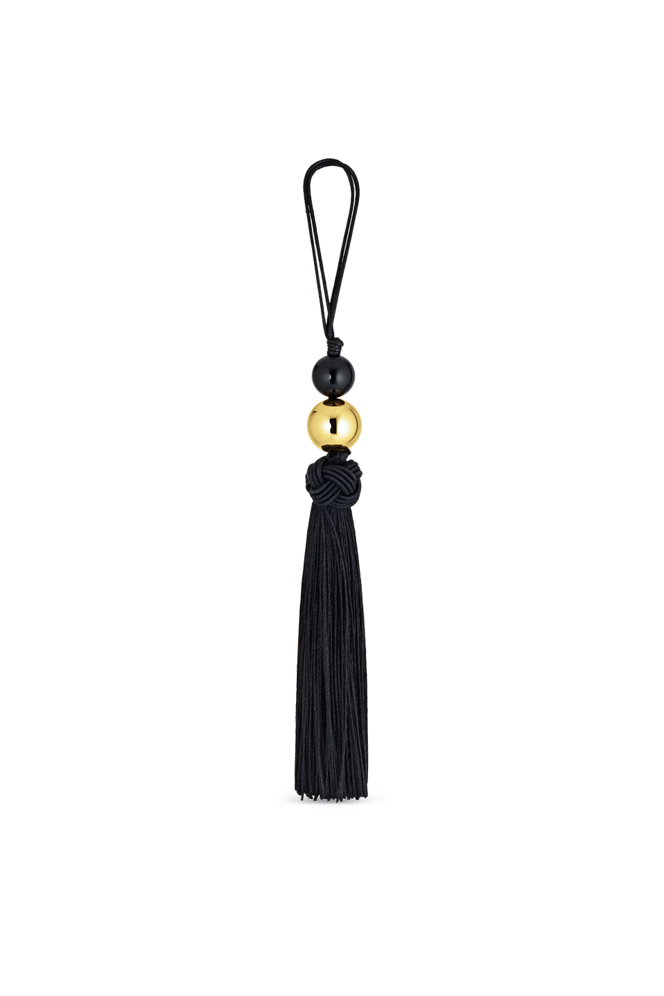 Cendré Lucetta black tassel bag charm with gold sphere on a white background