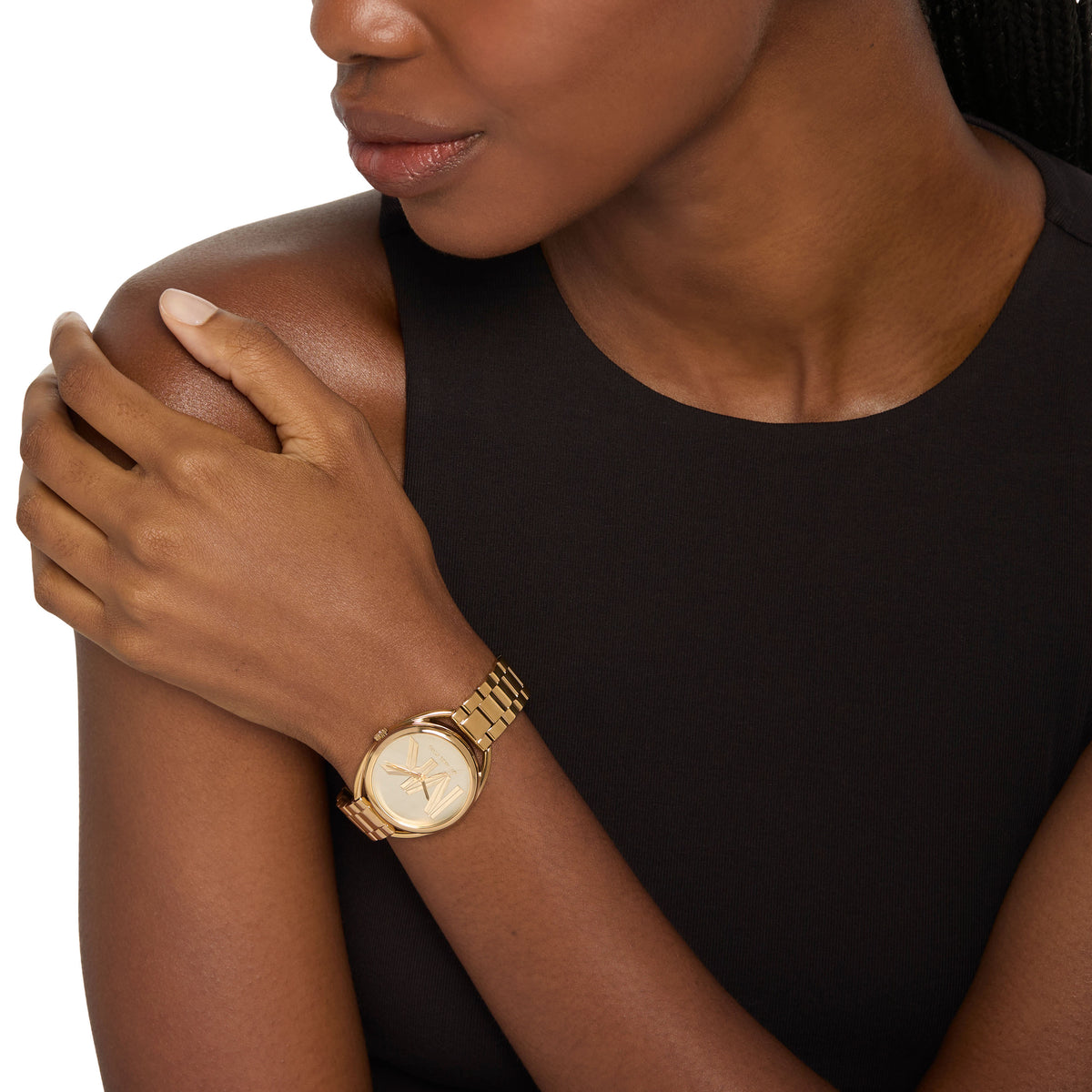 Michael Kors Leia Gold Logo MK7677 on the wrist