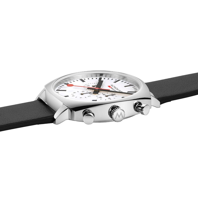 Wristwatch with a white dial, chronograph subdials, and a black strap.