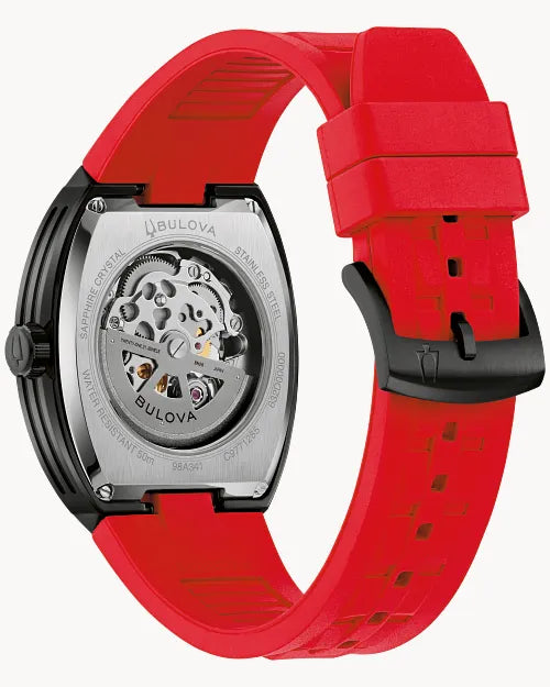 Bulova Maquina 98A341 automatic men's watch with black skeleton dial, black case and red rubber strap — detail view