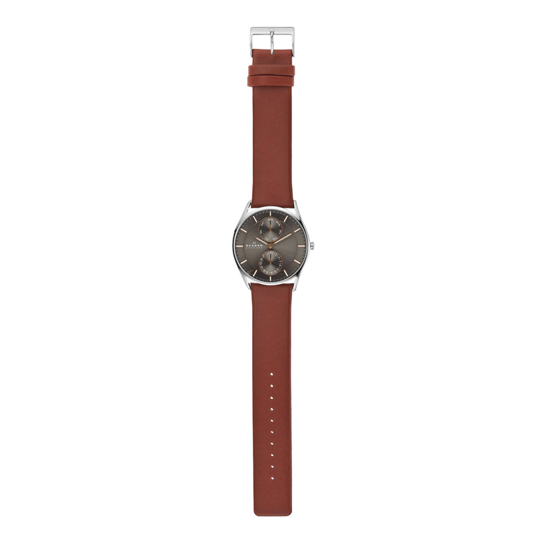 Wristwatch with a brown leather strap and gray dial face.