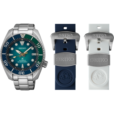 Seiko dive watch with blue-green dial and two additional watch straps.