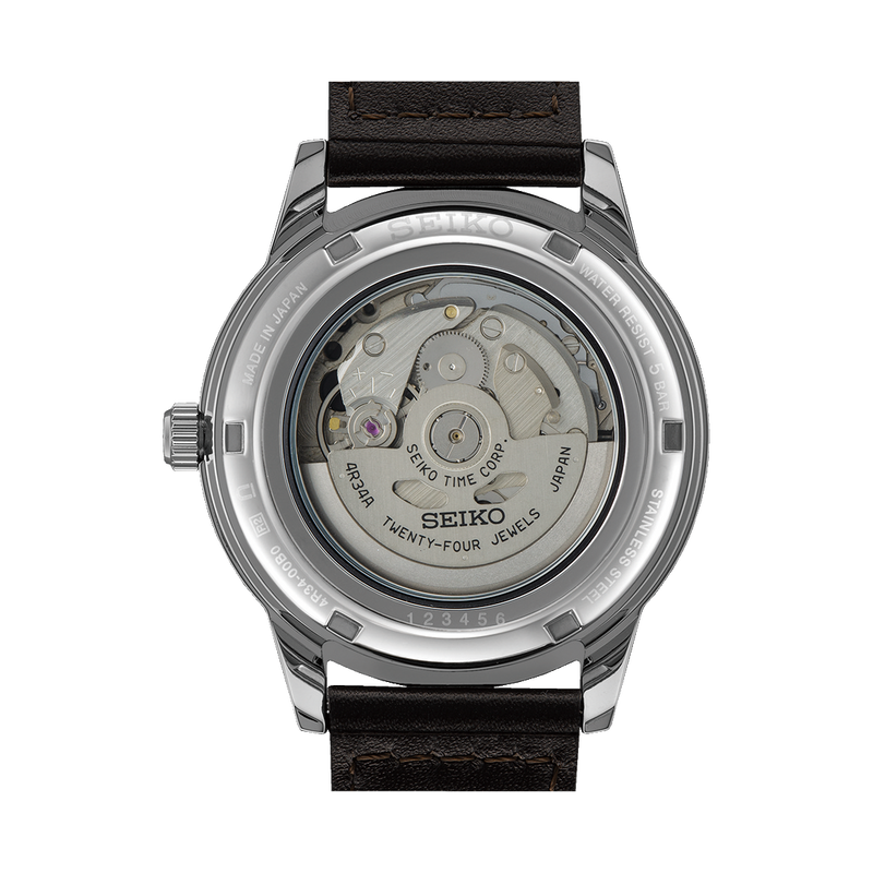 Back of a Seiko automatic watch showing its transparent case and movement mechanism.