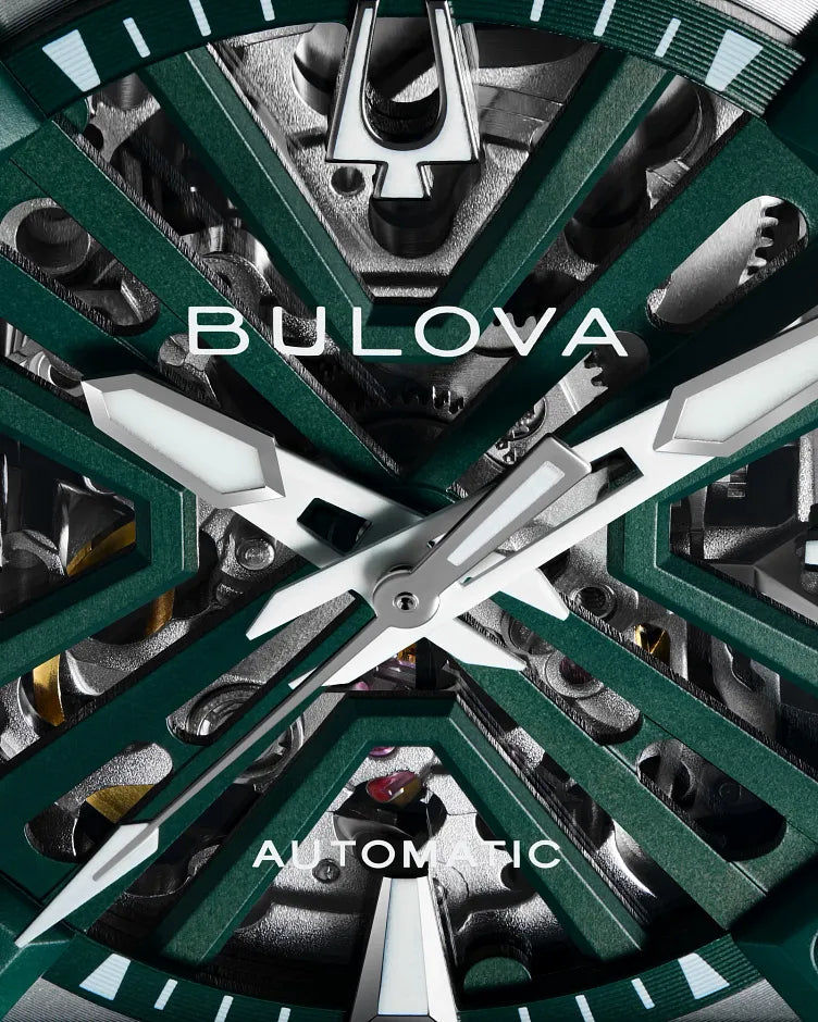 Bulova Series X 98A343 automatic men's watch with hunter green skeleton dial, green bezel insert and green suede strap — lifestyle view