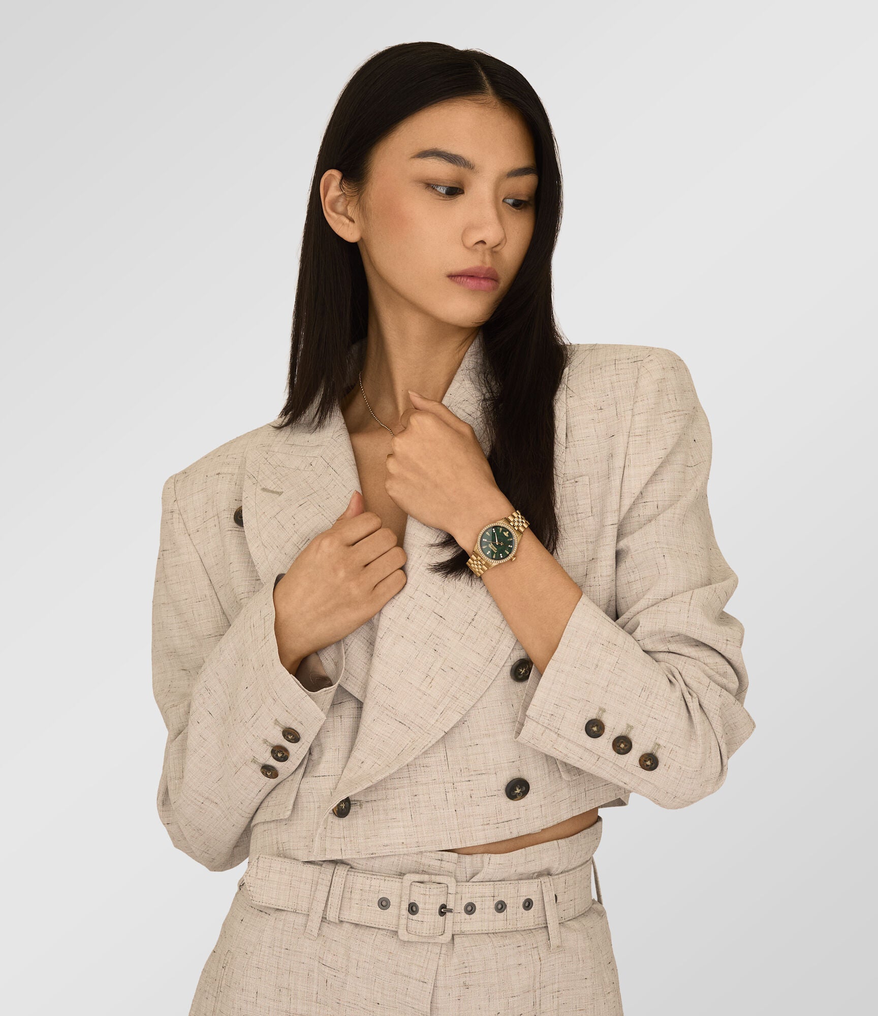Vivienne Westwood Little Wallace women's watch with a green dial and gold stainless steel bracelet. Shown at an angle.