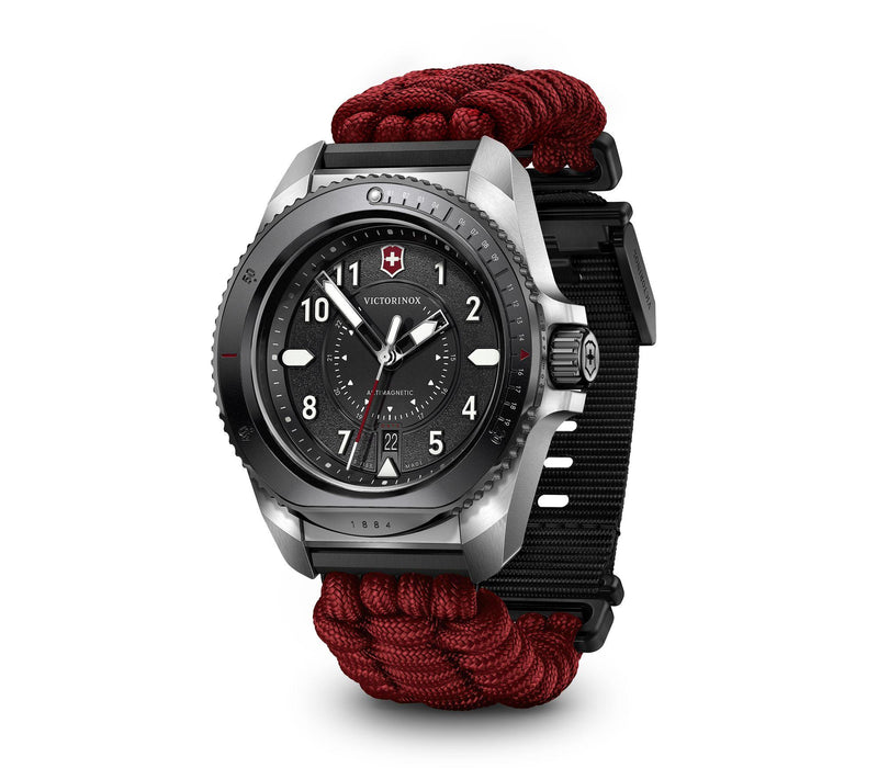 Rugged wristwatch with a black dial and red paracord-style band.