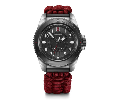 Wristwatch with a black dial and red paracord-style band.