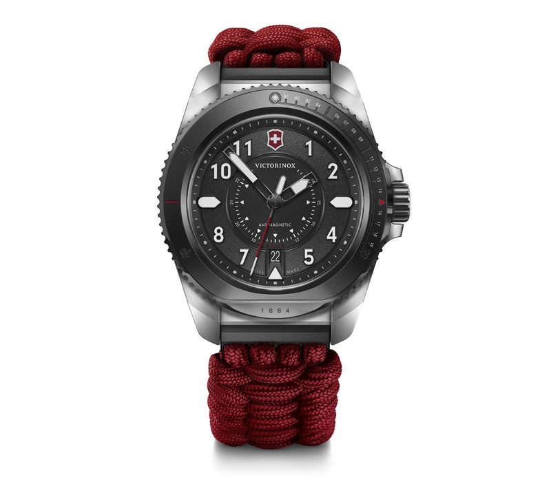 Wristwatch with a black dial and red paracord-style band.