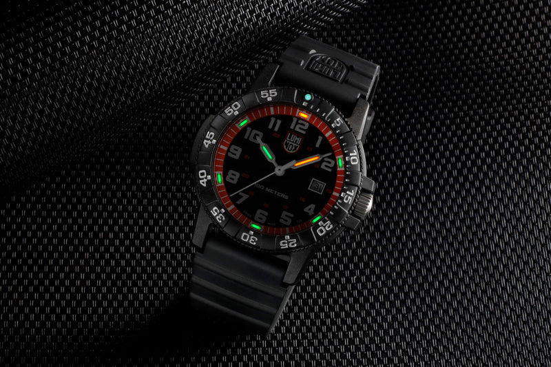 Black wristwatch with a colorful dial and rotating bezel.