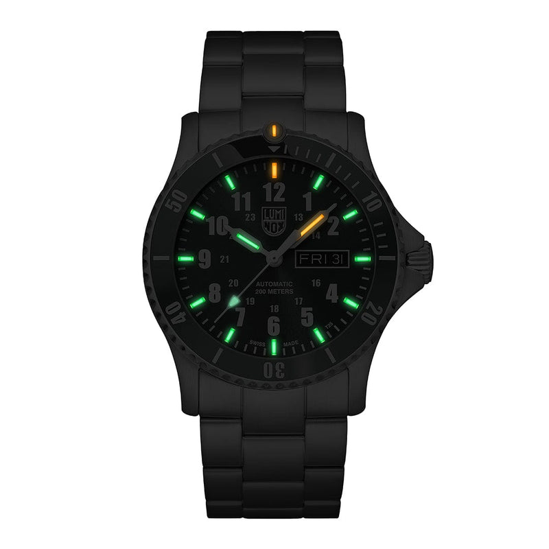 Black wristwatch with luminous green and orange markers on the dial.