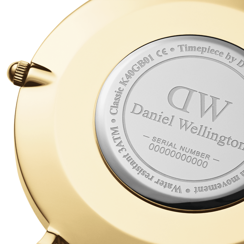 Back of a Daniel Wellington wristwatch showing engraved details on the case.