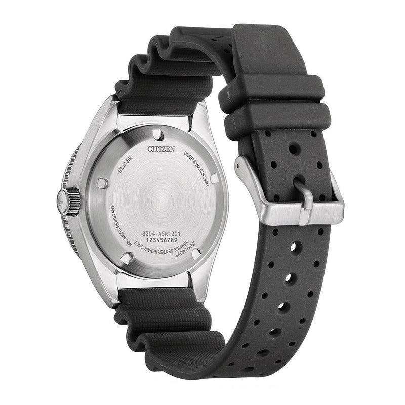 Wristwatch with a black rubber strap and silver-colored case back.