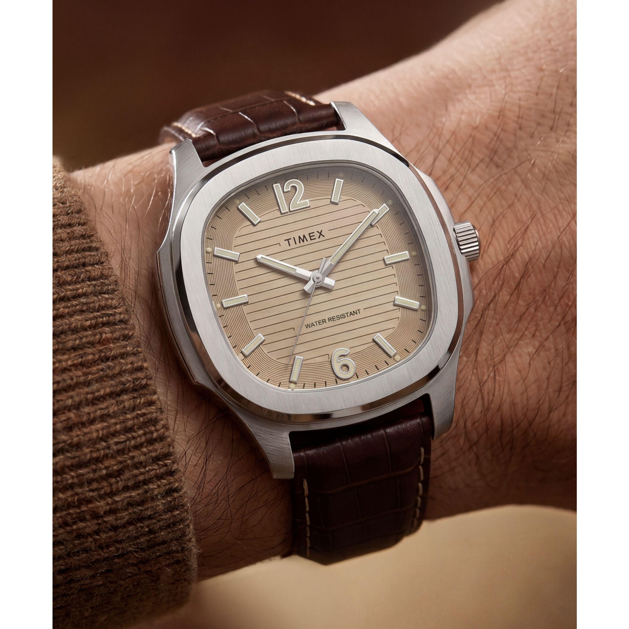 Timex TW2Y91600 khaki ribbed dial on a brown leather strap, worn on the wrist
