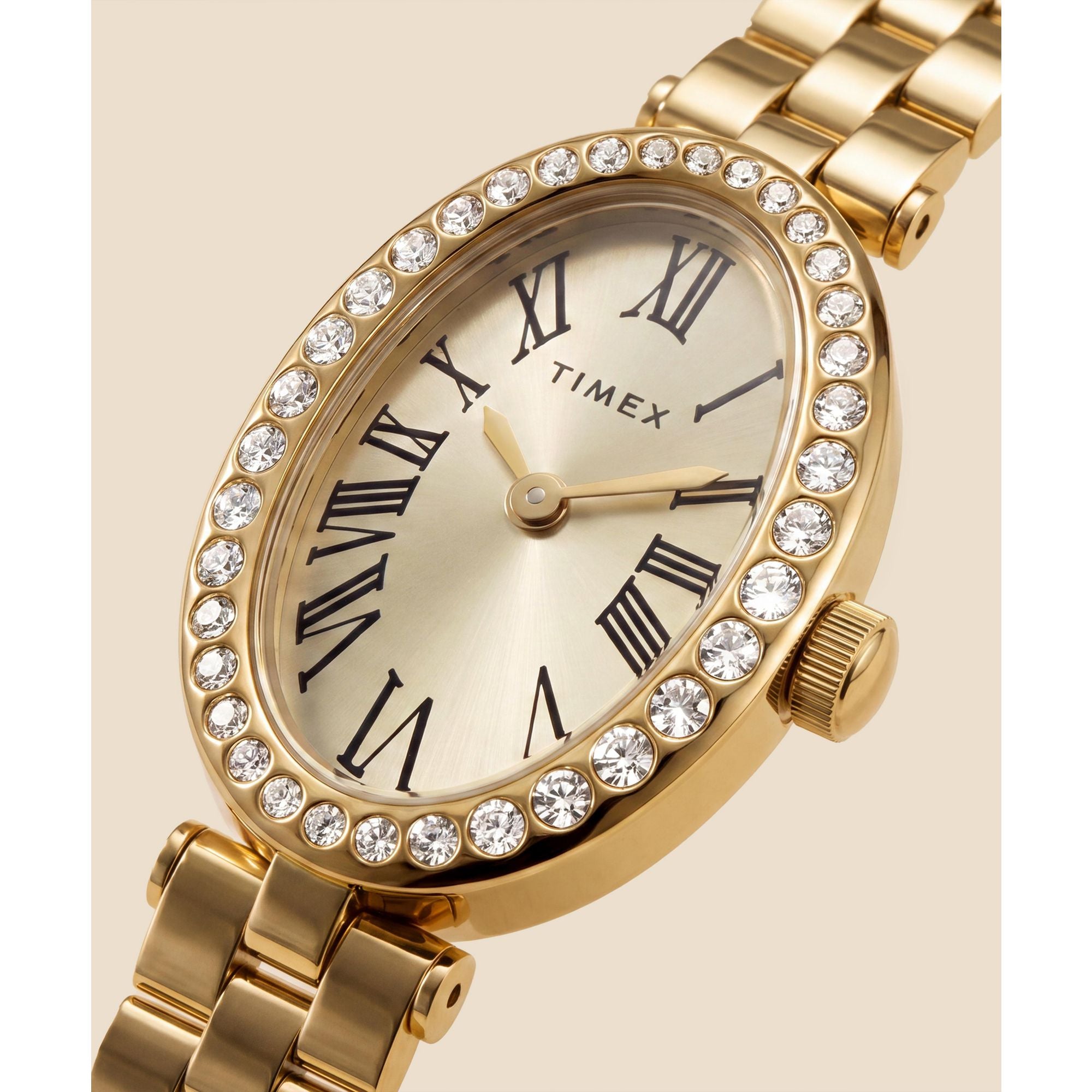 Timex Cavatina TW2Y90100 champagne dial with crystal-set bezel on a gold-tone bracelet, dial close-up