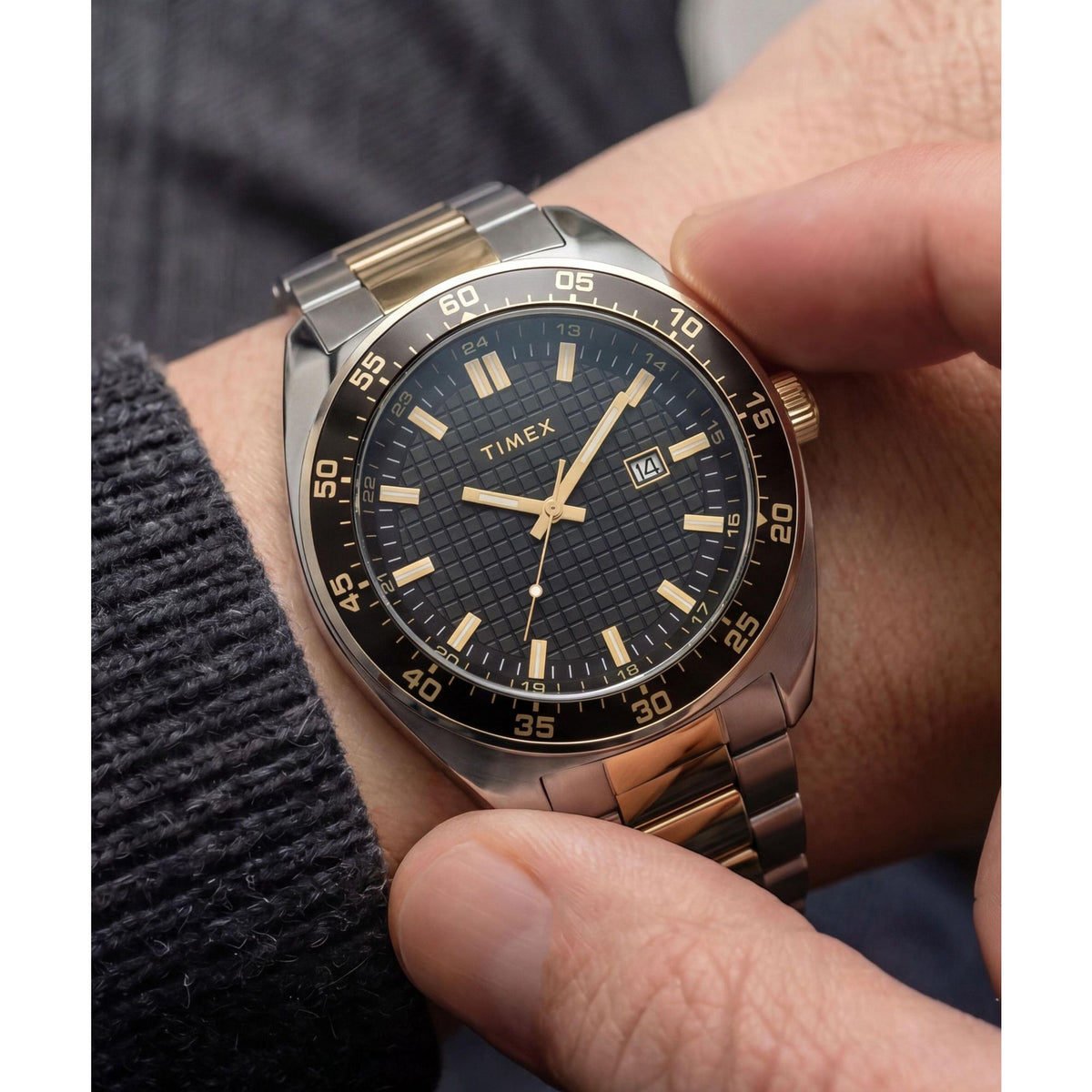 Timex Weston TW2Y89100 textured black dial on a two-tone bracelet, worn on the wrist