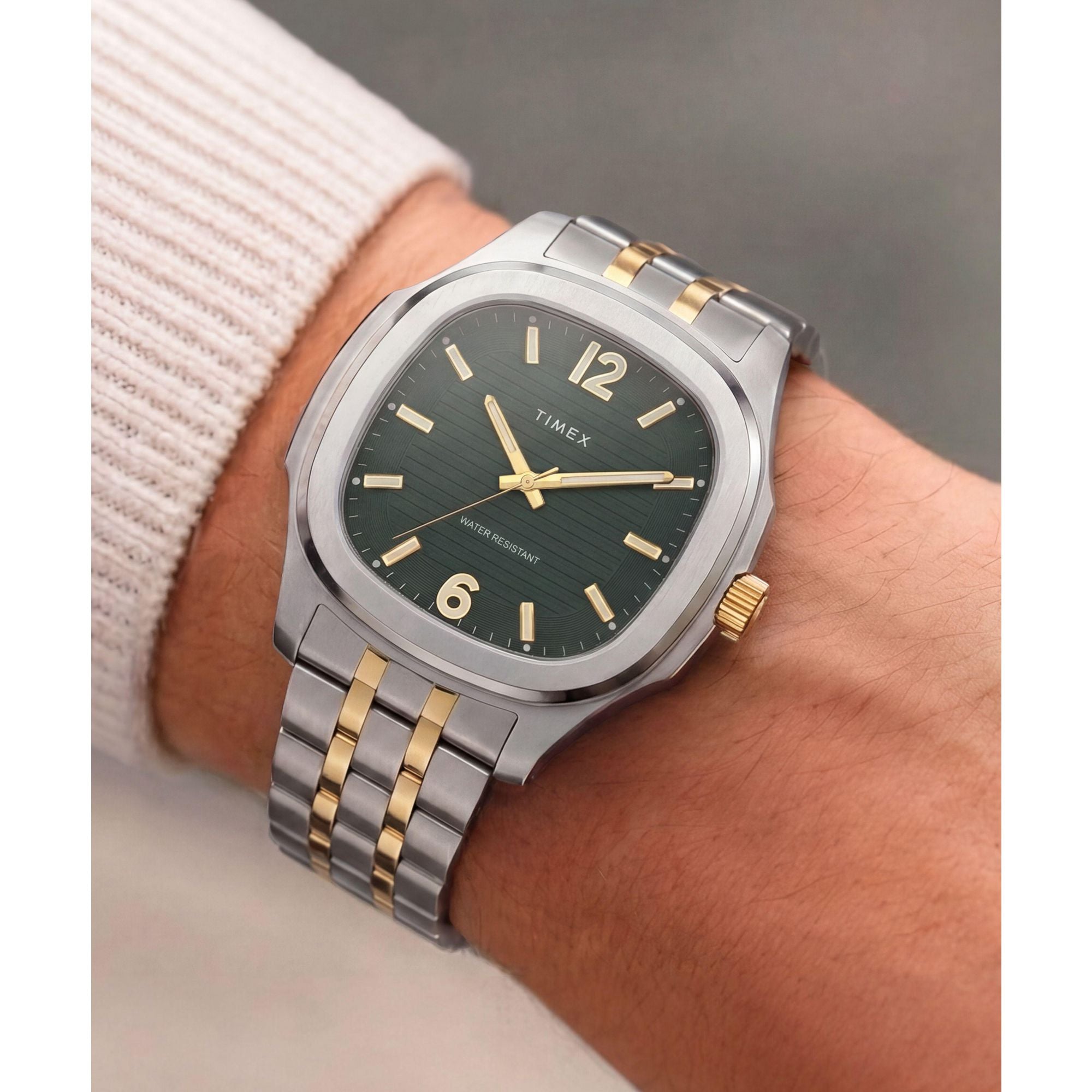 Timex TW2Y91400 green ribbed dial on a two-tone bracelet, worn on the wrist