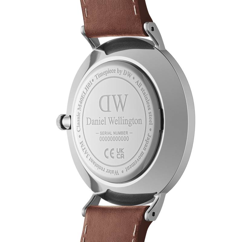 Back of a Daniel Wellington wristwatch with a brown leather strap.