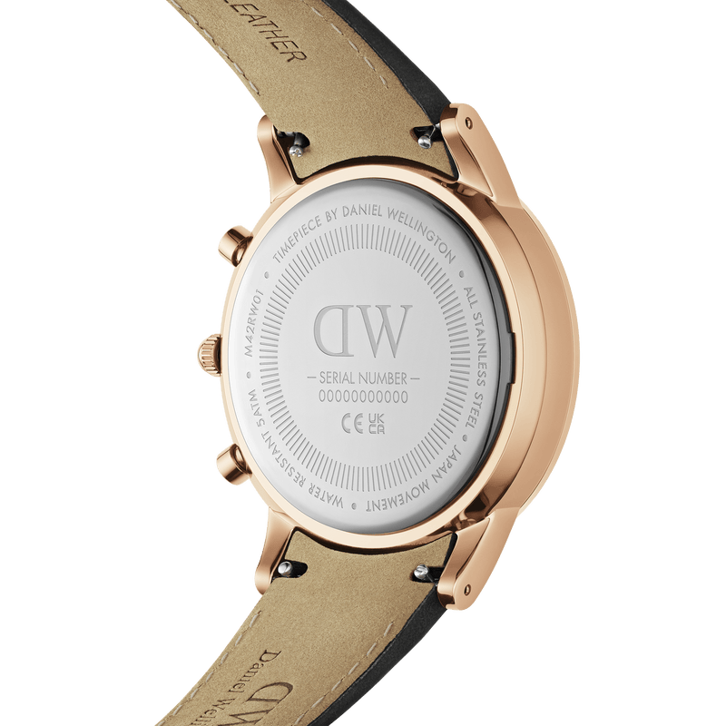 Rose gold wristwatch with a beige leather strap and a visible caseback.