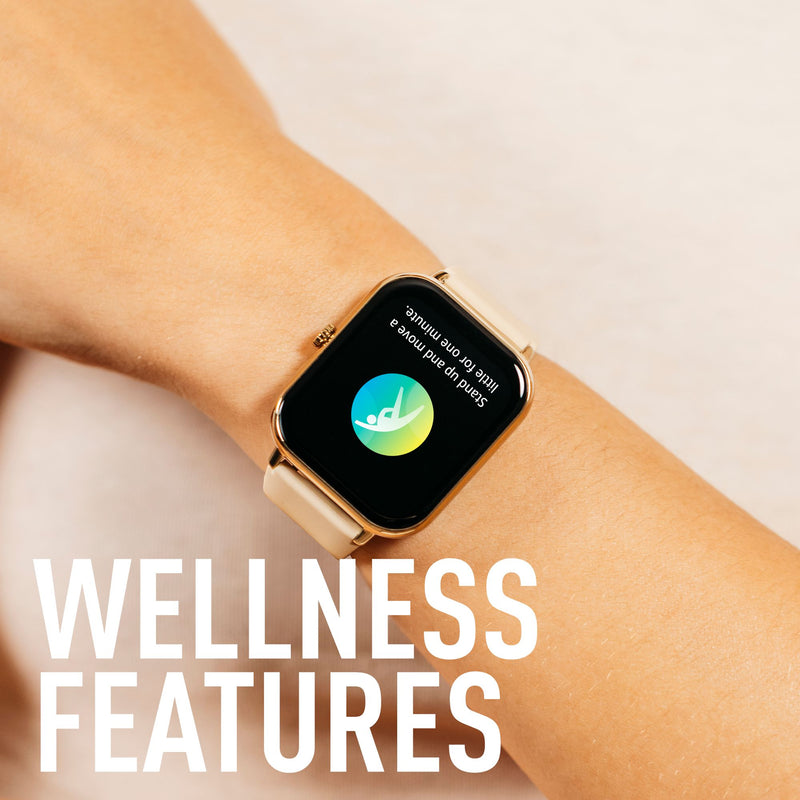 Gold smartwatch displaying a wellness app interface on a person’s wrist.