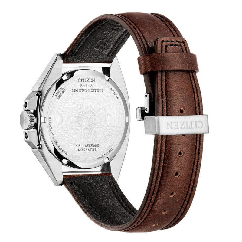 Wristwatch with a brown leather strap and silver-toned metal case.